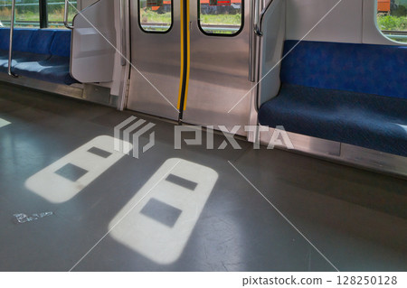Car seat door Musashino Line 205 series rapid train Kitafuchu Station platform 128250128