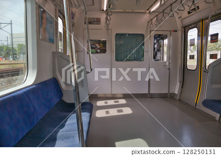 Car seat door Musashino Line 205 series rapid train Kitafuchu Station platform 128250131