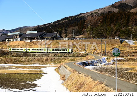 Roadside station Tono Kaze no Oka and the Kamaishi Line as seen from the rice paddy fields of Tono 128250381