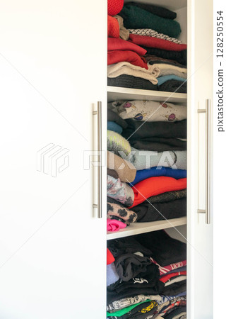 Closet Full of Clothes and Accessories 128250554