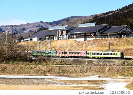 Roadside station Tono Kaze no Oka and the Kamaishi Line as seen from the rice paddy fields of Tono 128250600