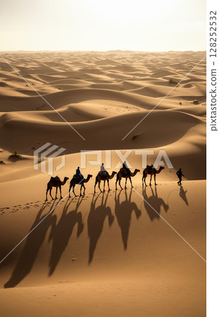 A caravan of camels moving along the Silk Road in the setting sun 128252532