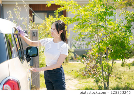 Woman cleaning the car 128253245