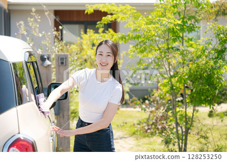 Woman cleaning the car Woman cleaning the car 128253250