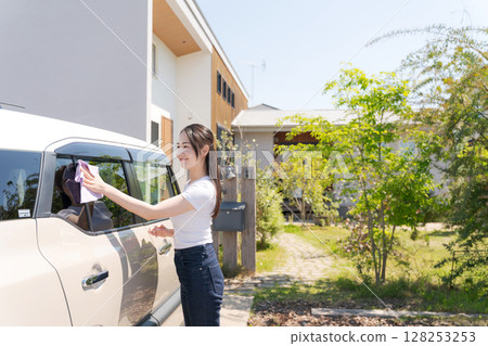 Woman cleaning the car Woman cleaning the car 128253253