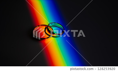 Wedding rings and rainbow light. Wedding rings and rainbow light. 128253920