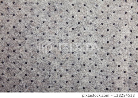 Grey felt material background with dark dots Grey felt material background with dark dots 128254538