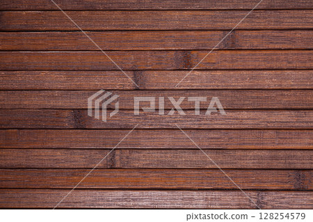 Dark brown wooden planks background with copyspace 128254579