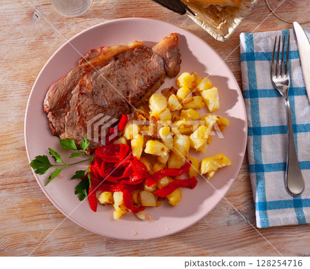 Beef entrecote with fried potato and baked sweet pepper Beef entrecote with fried potato and baked sweet pepper 128254716