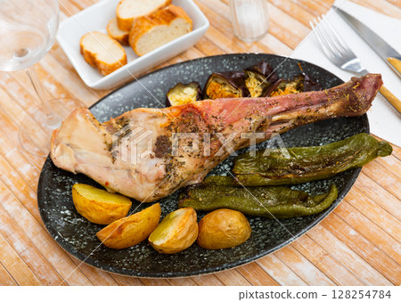 Lamb shoulder baked with new potatoes 128254784