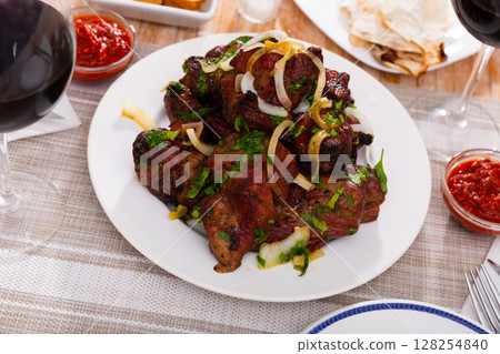 Pork shashlik with onion and greenery 128254840