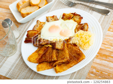 Pancakes with pork ham and fried eggs Pancakes with pork ham and fried eggs 128254863