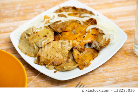 Appetizing pickled milk mushrooms with onion Appetizing pickled milk mushrooms with onion 128255036