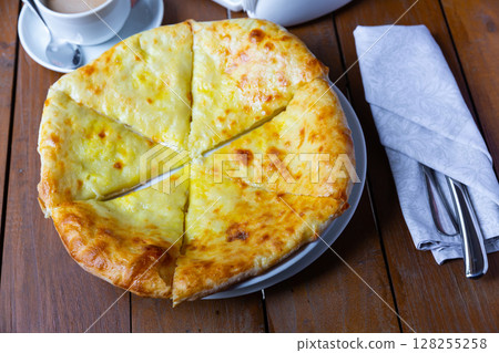 Delicious dish khachapuri Iveria with suluguni cheese Delicious dish khachapuri Iveria with suluguni cheese 128255258