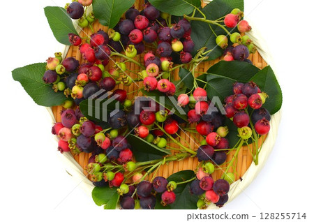 Colorful Juneberries on a tray 128255714