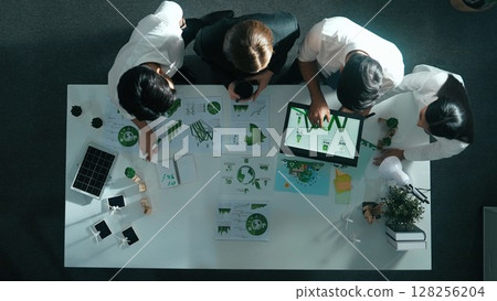 Top view of manager hold tablet display clean energy at meeting. Alimentation. Top view of manager hold tablet display clean energy at meeting. Alimentation. 128256204