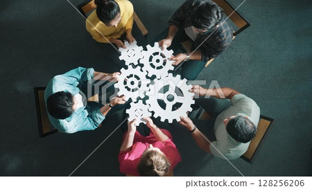 Top view of smart business people joining and gathering white gear. Symposium. Top view of smart business people joining and gathering white gear. Symposium. 128256206
