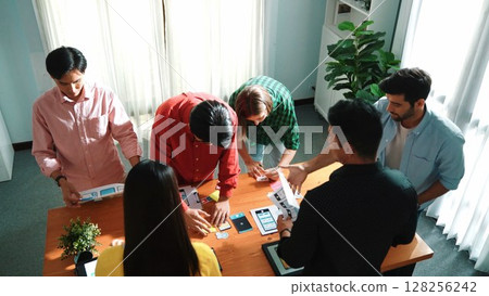 Top view of skilled Ui designer brainstorming about Ux Uo design. Convocation. 128256242