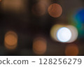 Abstract bokeh background featuring soft glowing orange and white lights on dark Abstract bokeh background featuring soft glowing orange and white lights on dark 128256279