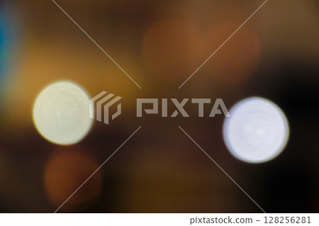 Abstract bokeh background featuring soft glowing orange and white lights on dark Abstract bokeh background featuring soft glowing orange and white lights on dark 128256281