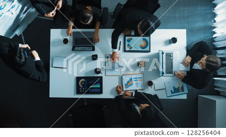 Top view of boss invites manager to explain about marketing plan. Directorate. 128256404