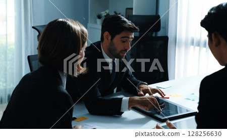 Back view of businessman work on laptop while team analysis data. Directorate. 128256630