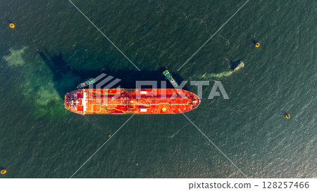 Aerial view oil ship tanker vessel loading and unloading in oil terminal station refinery, Global business import export logistic transport sea freight cargo tanker, Red crude oil tanker ship at port. 128257466