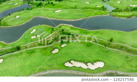 Aerial top view golf course with lush greens, green fairway and sand bunker, Golf course green grass and trees fairway and putting green, Beautiful golf course. Aerial top view golf course with lush greens, green fairway and sand bunker, Golf course green grass and trees fairway and putting green, Beautiful golf course. 128257598