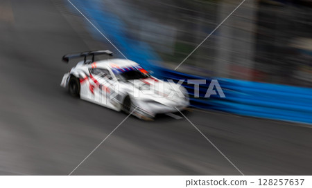 Motion blur race car racing on speed track, Motion blurred super car race on street track circuit, Automobile automotive transportation vehicle background, Motion blur race car racing on speed track, Motion blurred super car race on street track circuit, Automobile automotive transportation vehicle background, 128257637