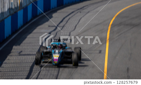 Motion blur race car racing on speed track, Motion blurred super car race on street track circuit, Automobile automotive transportation vehicle background, Race car drive on street track. Motion blur race car racing on speed track, Motion blurred super car race on street track circuit, Automobile automotive transportation vehicle background, Race car drive on street track. 128257679
