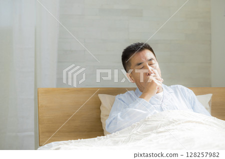 Senior man in bed Senior man in bed 128257982