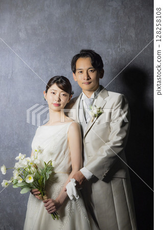 Bride and groom in wedding dress Bride and groom in wedding dress 128258108