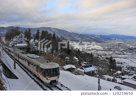 The Shinano Express runs through the white world of Obasute The Shinano Express runs through the white world of Obasute 128259650