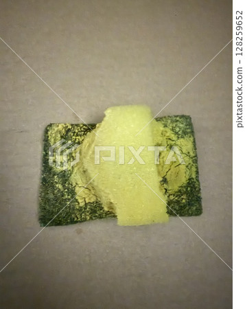 A deteriorated and worn-out sponge 128259652