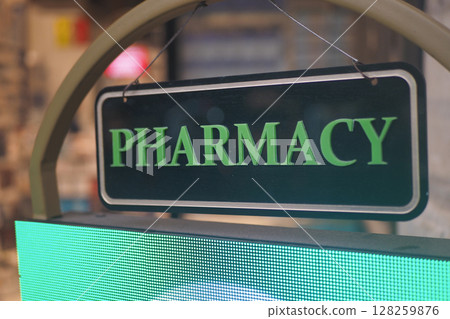 pharmacy sign on shop in street pharmacy sign on shop in street 128259876