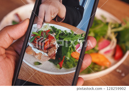 Mobile Photograph of a Delicious Meal on a Wooden Dining Table Mobile Photograph of a Delicious Meal on a Wooden Dining Table 128259902