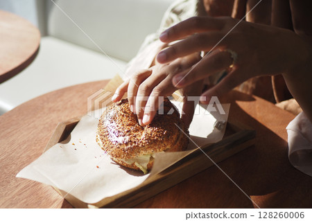 Enjoying a freshly baked pastry at a cozy cafe 128260006