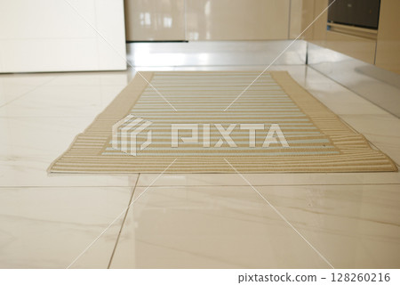 Kitchen rug on tiled floor in a modern setting 128260216