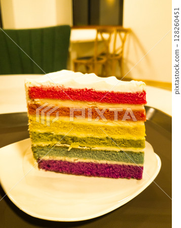 Fresh baked homemade Rainbow cake set on table. 128260451
