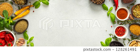 Colorful, fresh herbs and spices framing a gray background, a perfect natural border to bring attention to culinary creativity, top view and copy space, banner Colorful, fresh herbs and spices framing a gray background, a perfect natural border to bring attention to culinary creativity, top view and copy space, banner 128261491