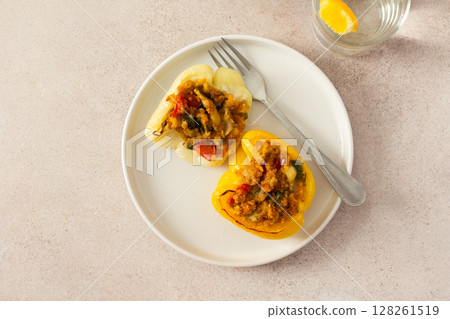 This nutritious dish of stuffed bell peppers with quinoa, lentils, and vegetables makes for a hearty, plant-based meal thats both flavorful and satisfying, perfect for any time of day This nutritious dish of stuffed bell peppers with quinoa, lentils, and vegetables makes for a hearty, plant-based meal thats both flavorful and satisfying, perfect for any time of day 128261519