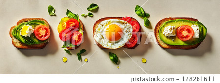 Brightly colored breakfast boards showcase toasted bread topped with eggs, avocado, tomatoes, and fresh herbs, perfect for a nutritious start to the day, banner 128261611