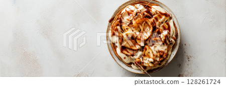 Enjoy a delightful seasonal breakfast with warm cinnamon apple crepes, perfectly rolled and served alongside fresh green apples, perfect for any morning, banner 128261724