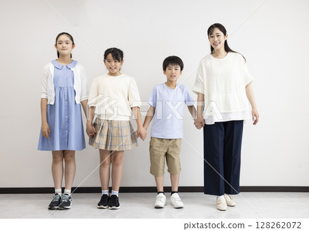 Cute elementary school students and their teacher lined up Cute elementary school students and their teacher lined up 128262072