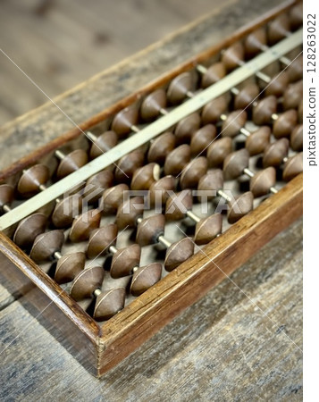 Close-up of an abacus on a desk 128263022
