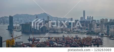 July 6 2025 Panoramic View of a Modern Cityscape and Harbor on a Cloudy Day 128263069