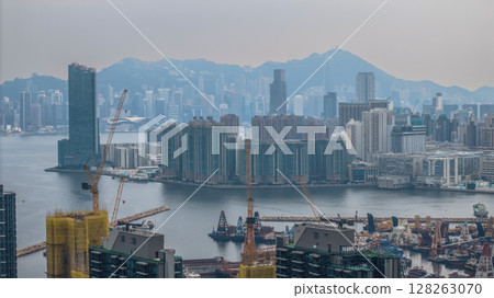 July 6 2025 Panoramic View of a Modern Cityscape and Harbor on a Cloudy Day 128263070