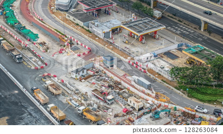 July 6 2025 Modern Road Construction Site with Heavy Machinery and Infrastructure Development 128263084