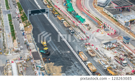July 6 2025 Modern Road Construction Site with Heavy Machinery and Infrastructure Development 128263085