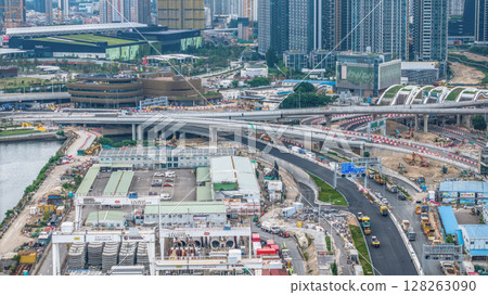 July 6 2025 Modern Road Construction Site with Heavy Machinery and Infrastructure Development 128263090